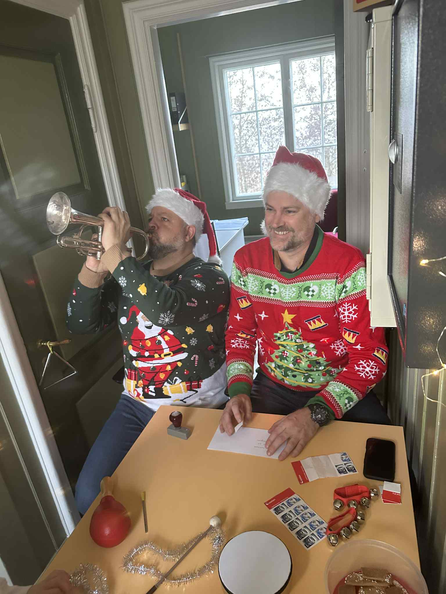 a person in a garment painting a person's face